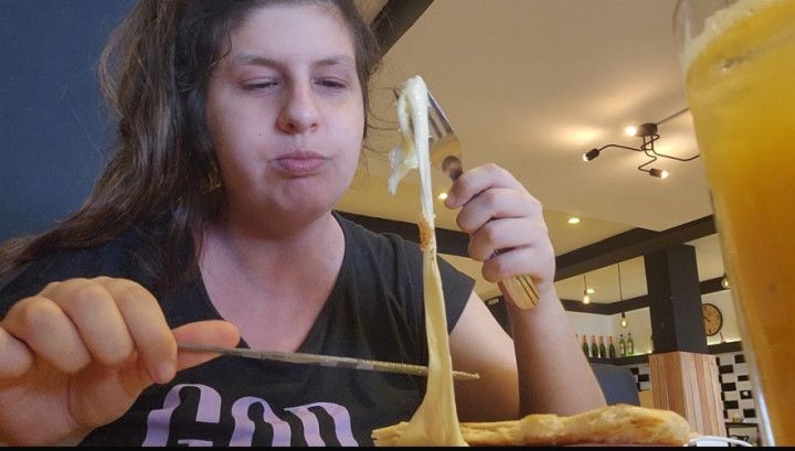 Cheesy Breakfast Delight: Savoring a Gooey Sandwich