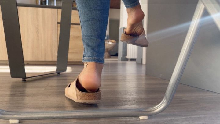 Birkenstock and jeans under the table