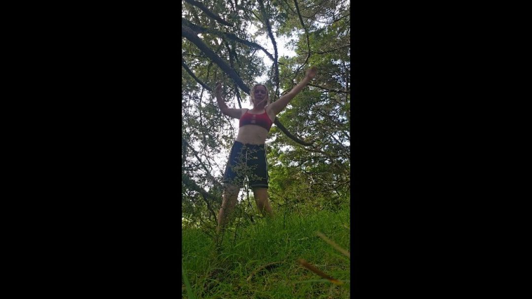 Working out and stretching in the forest