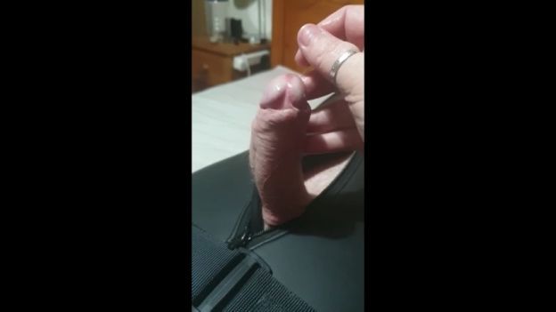 Miss M Inflicts a handjob on helpless man bound in tight neo