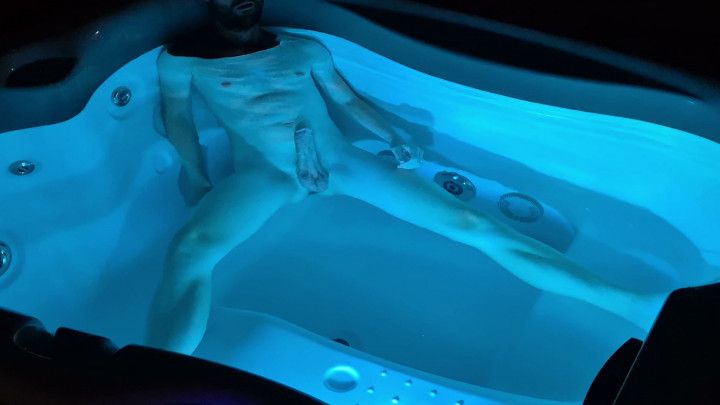 Boy takes a bath at night in a lit bathtub and gets excited