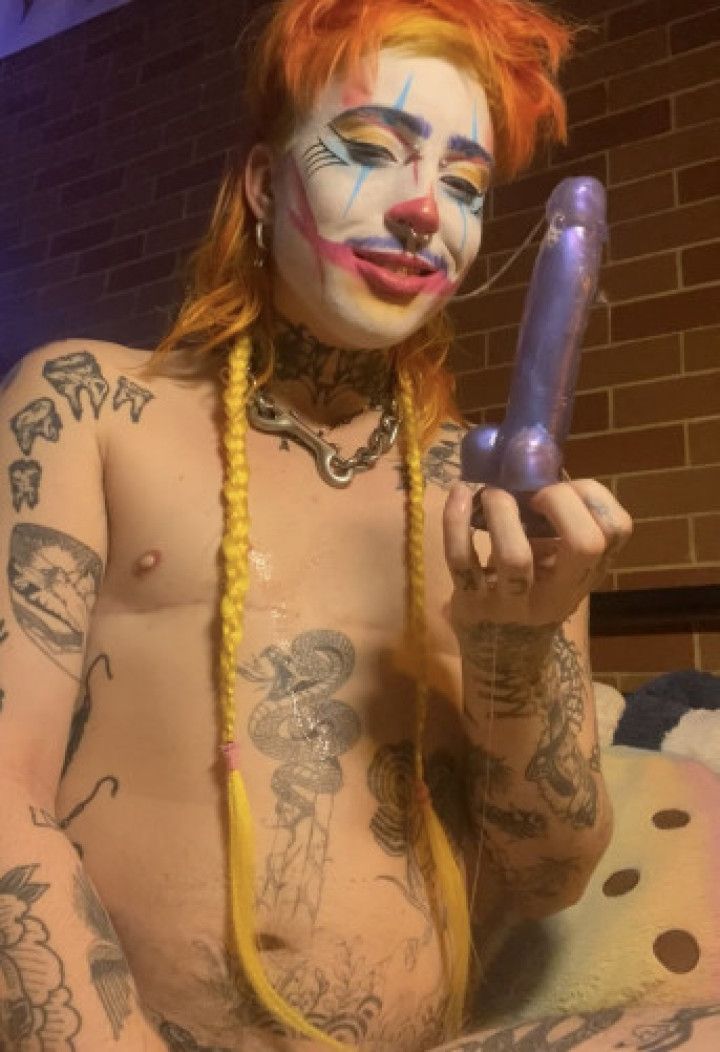 Clown Plays With Spit While Stretching