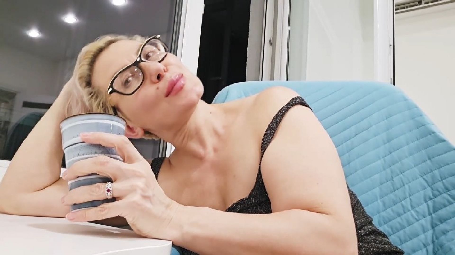 Mommy drinks tea and relaxes in the kitchen