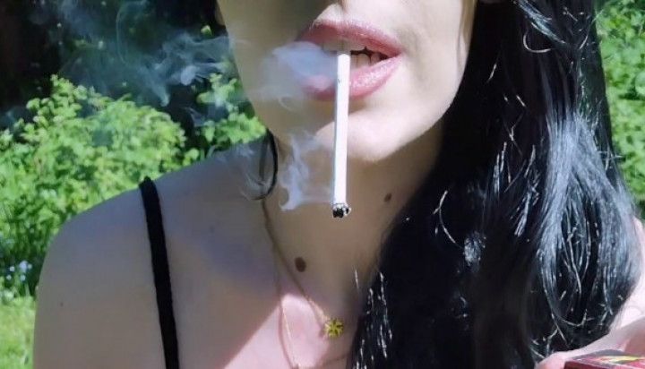 I smoke cigarettes and show off my beautiful pussy