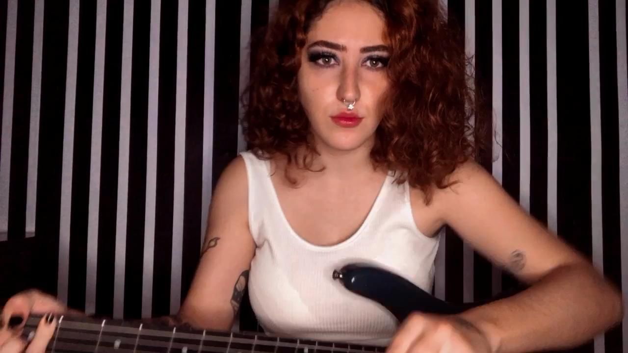 Sexy girl Playing bass guitar