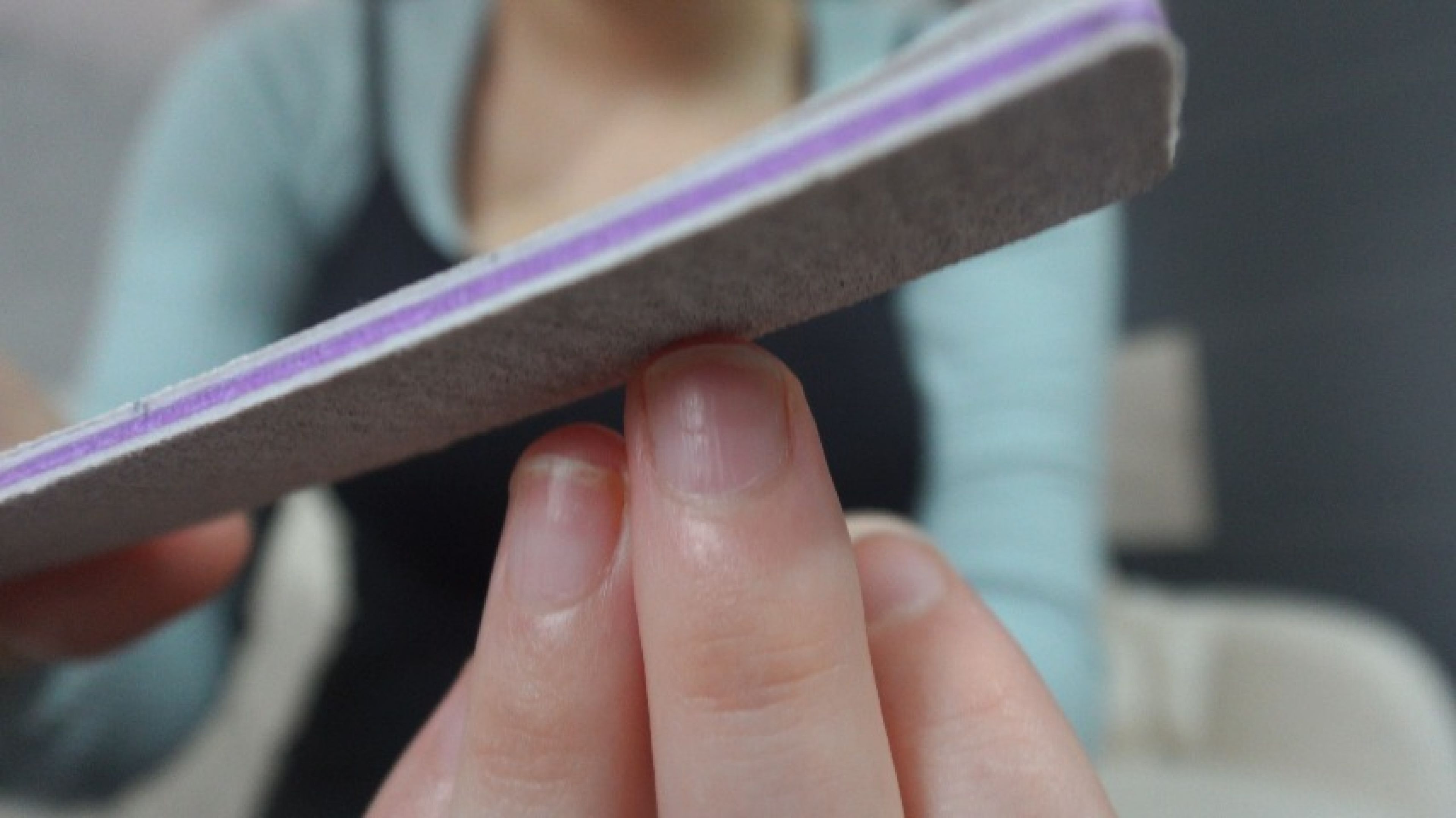 I'm bored so I file my nails with a nail file