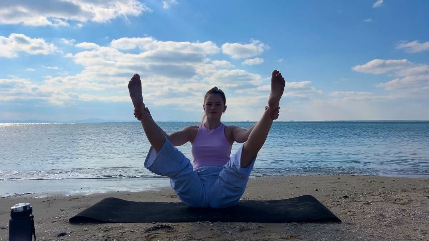 redhead beauty yoga on the beach