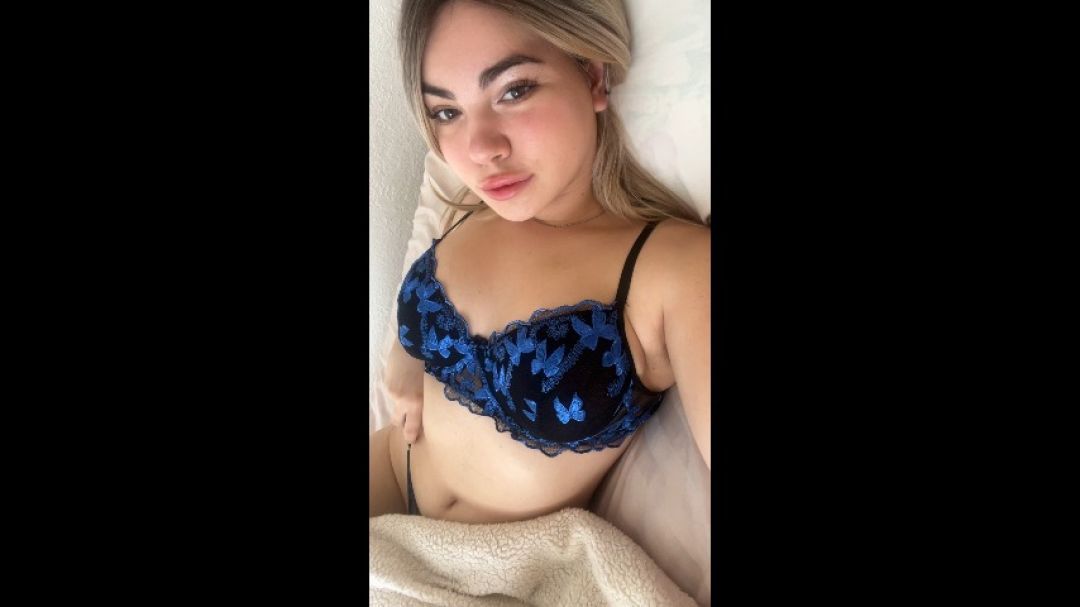 Hot blonde plays with her belly button