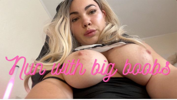 Naughty nun plays with her big tits
