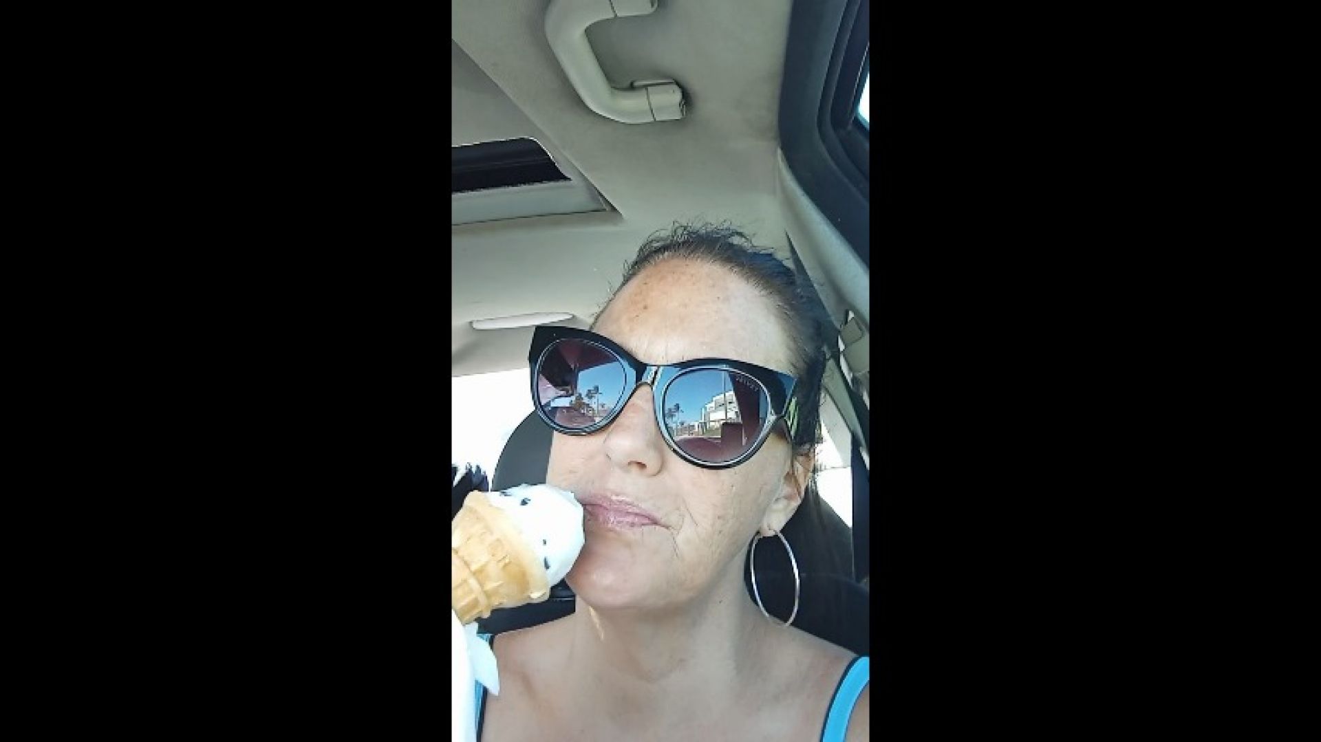 Gigi licking ice cream cone