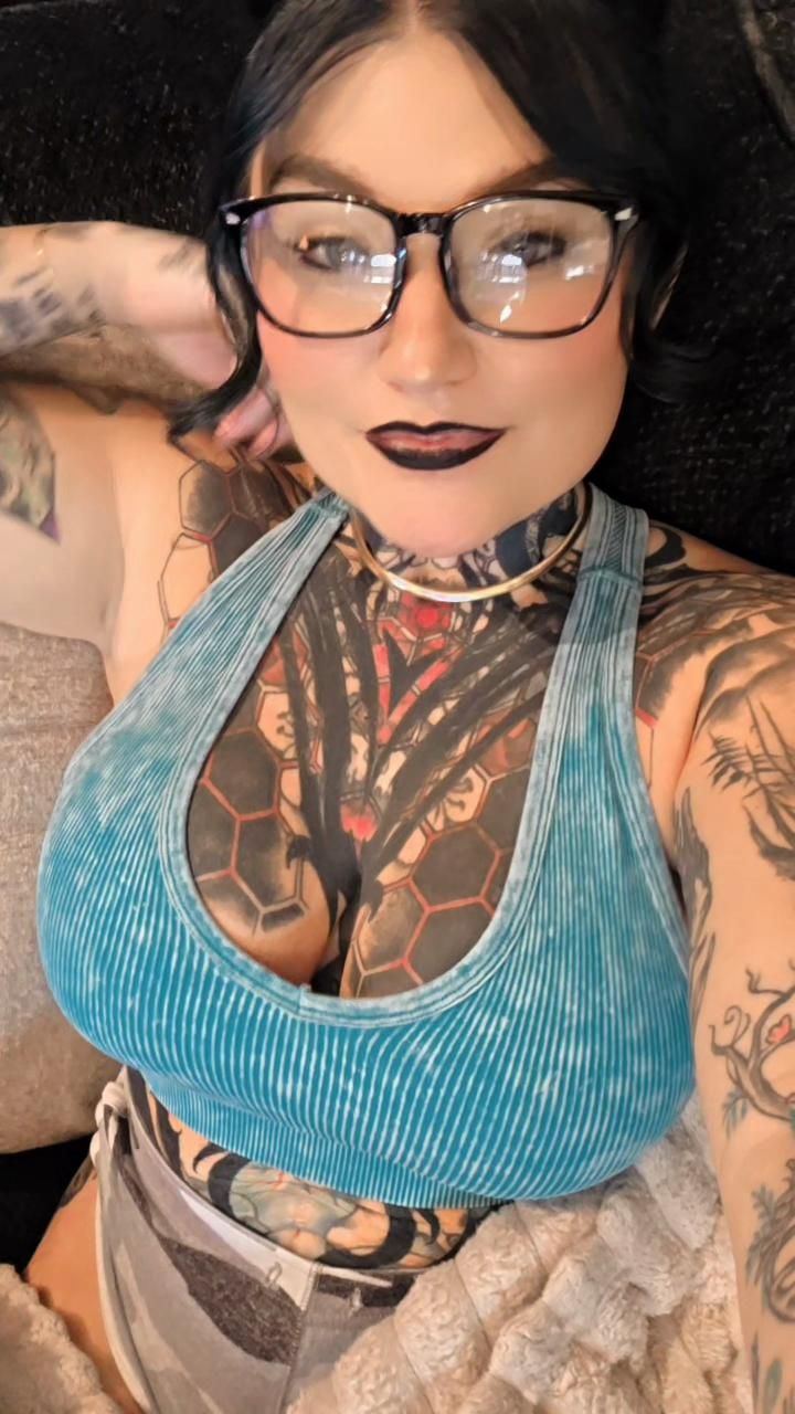 Tattooed girl in lounge clothes