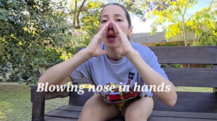 Blow trumpet nose in hands