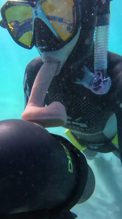 Underwater dildo blowjob at sea