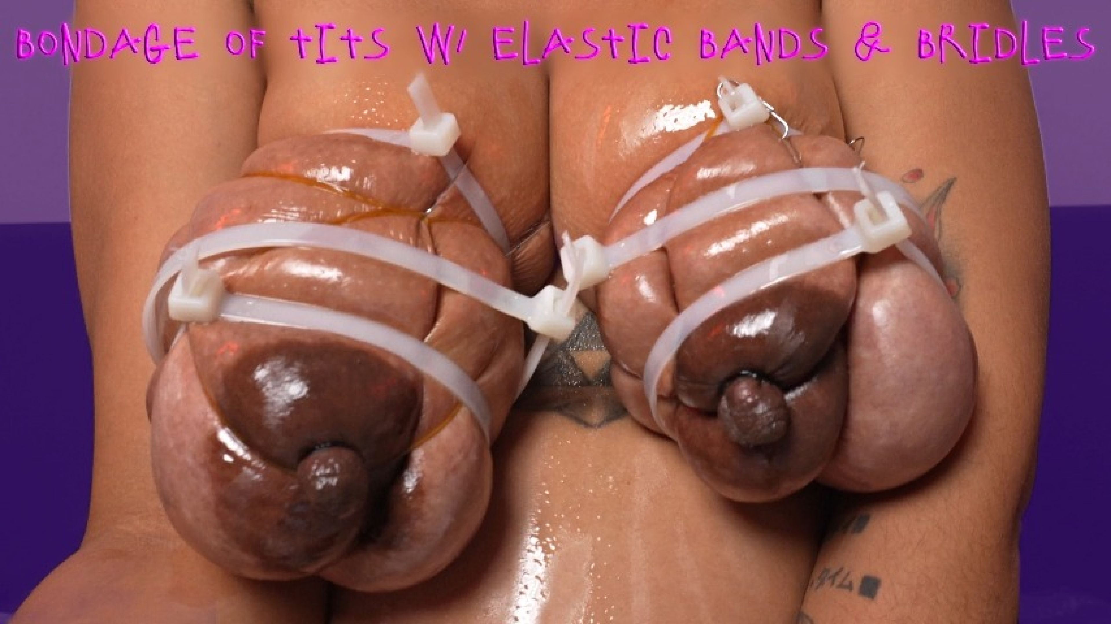 Bondage of tits with elastic bands and plastic ties