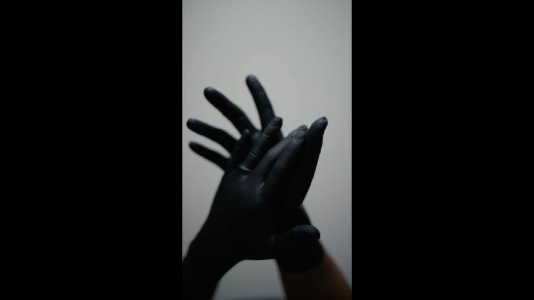 Putting on Black Nitrile Gloves POV
