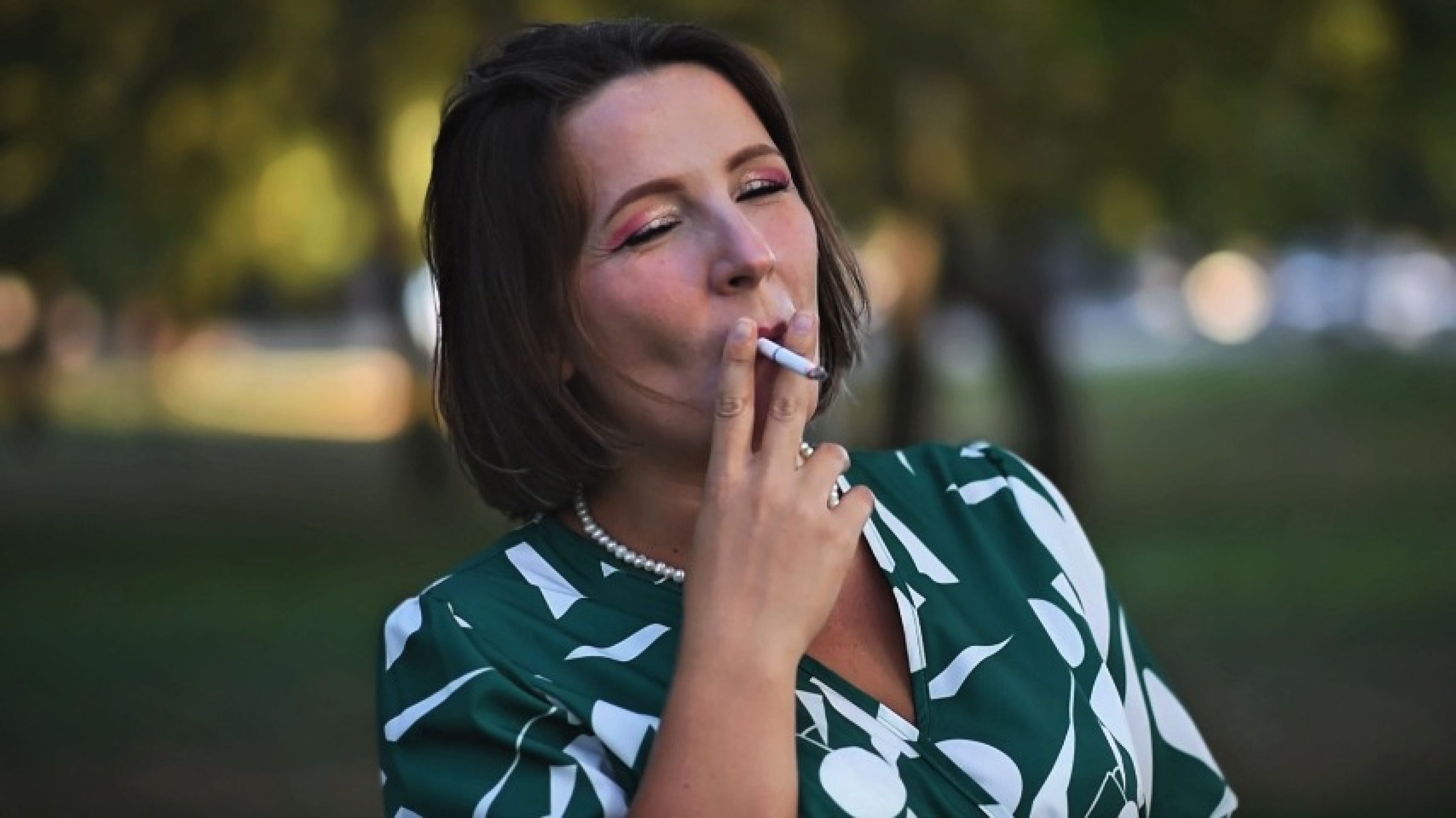 I take a drag on my cigarette, blowing smoke in your direct