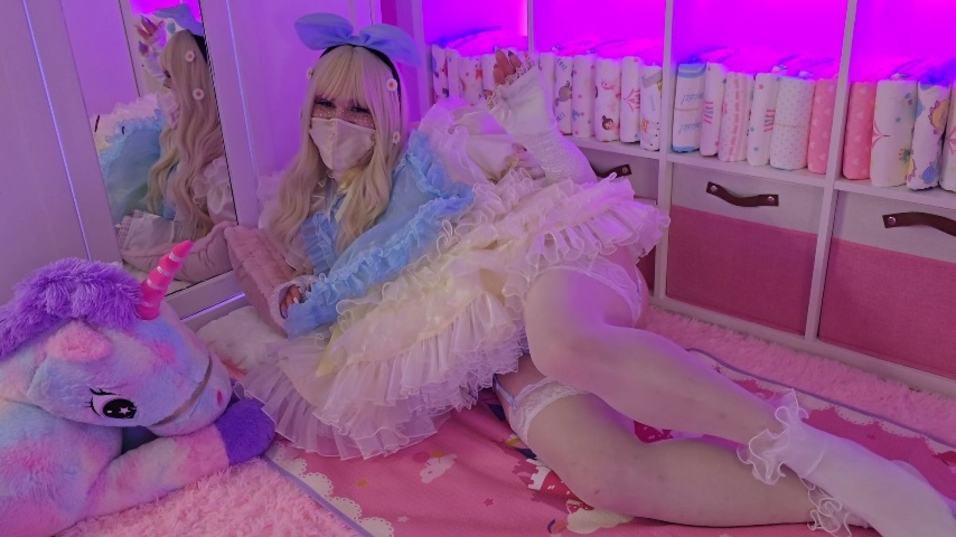 An adorable little sissy maid plays with her toys