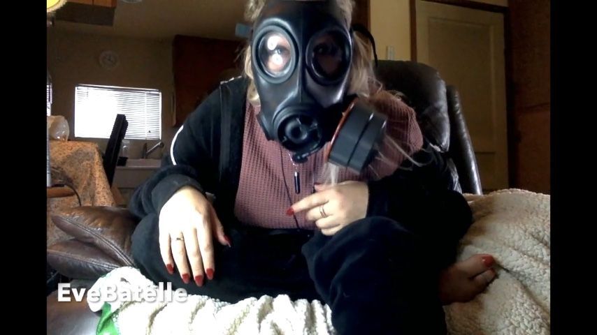 Executrix Prepares Her Gas Mask
