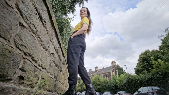 Outdoor jogging bottoms wetting by the road peeing