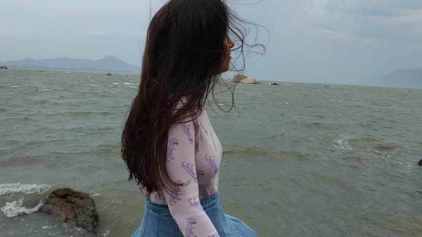 Public flashing windy beach