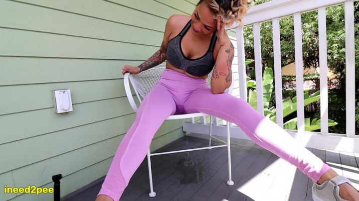 Omorashi Loosey Lu wetting pink yoga pants on balcony