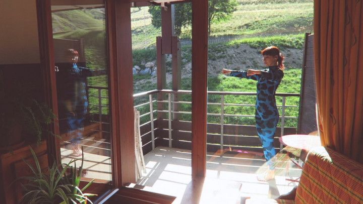 Balcony workout. Sportswear suit. Voyeur