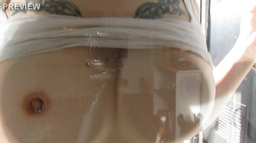 Wet tits against window